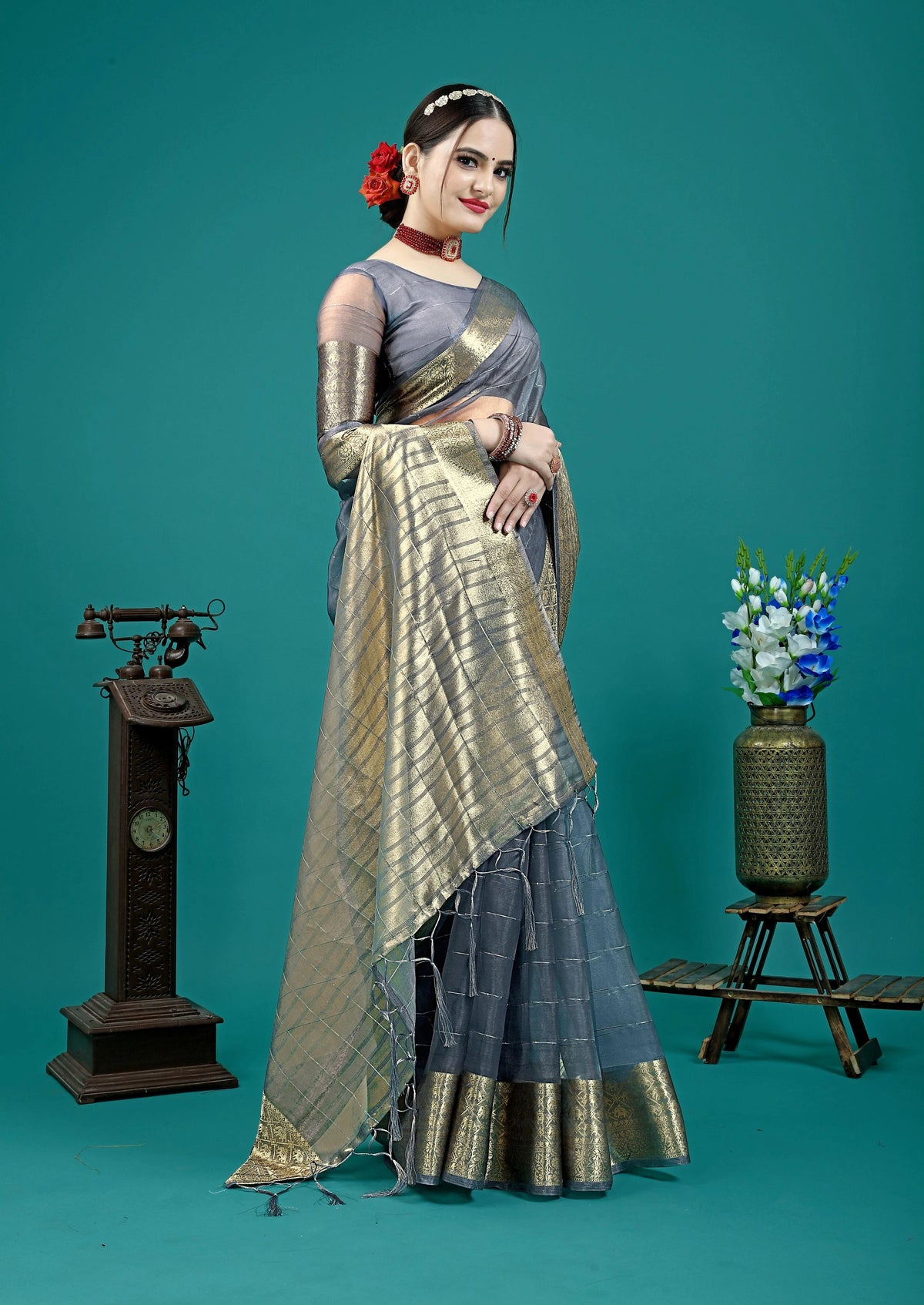 Traditional silk saree featuring rich pallu and tassel accents.