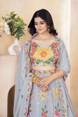 Woman wearing a floral embroidered outfit with a neutral background