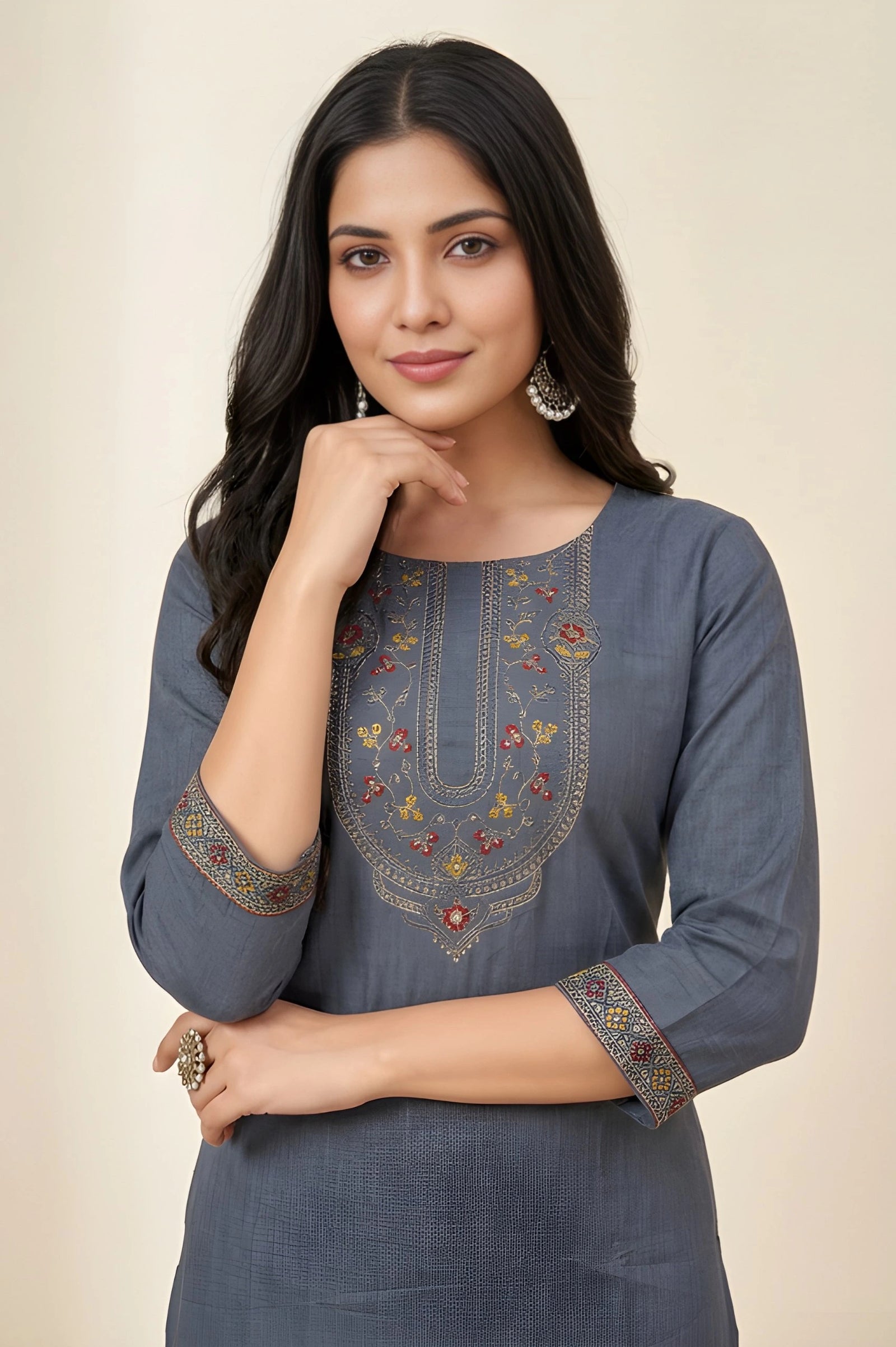 Woman wearing a blue embroidered kurta against a beige background