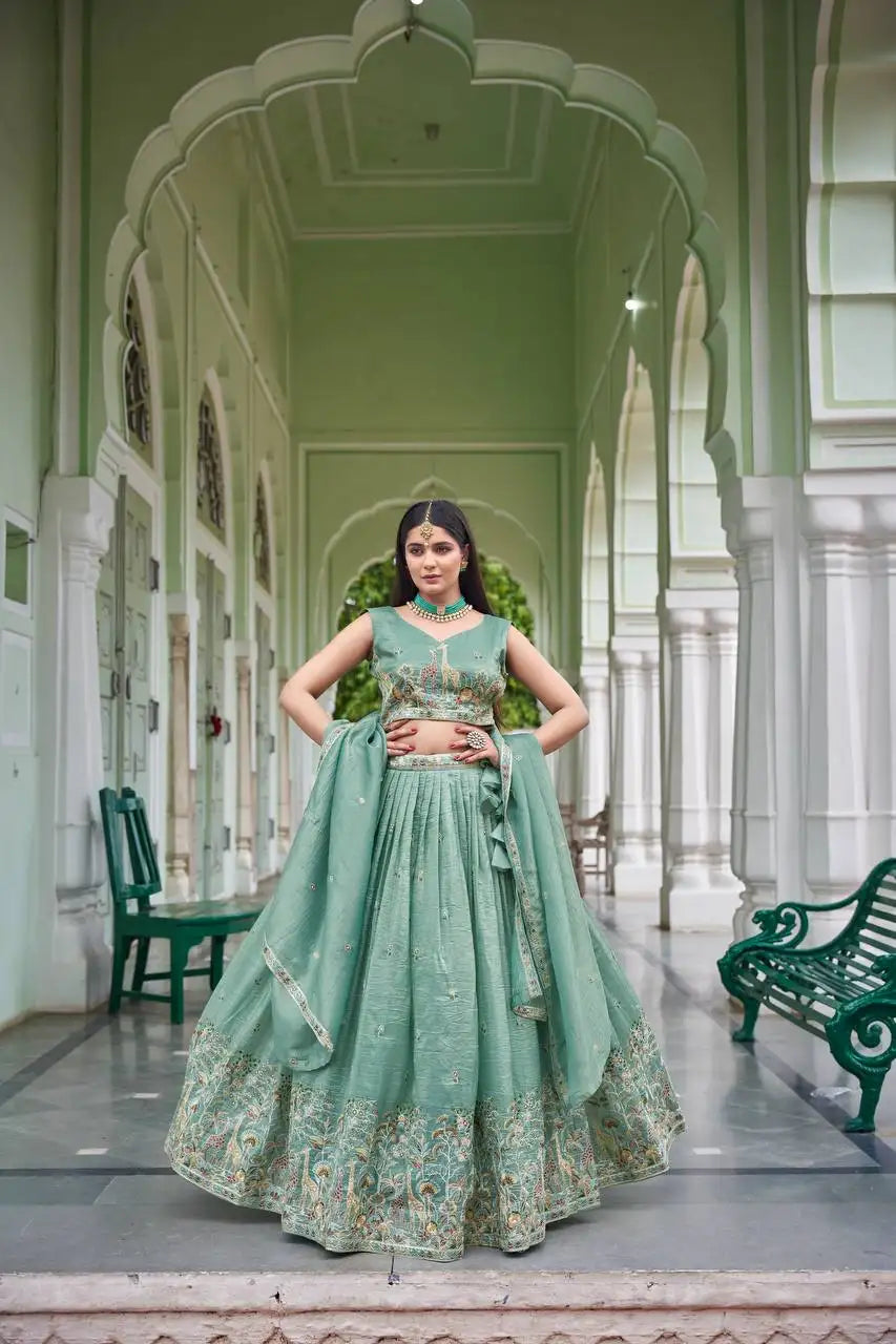 Full length front view of green gold crush lehenga with multicolor Mughal border and dupatta