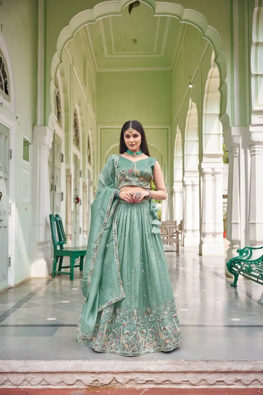 Green thread embroidered lehenga in premium gold crush with giraffe motif choli, full front view