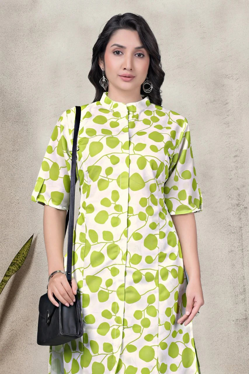 Woman wearing a green and white patterned dress against a beige background