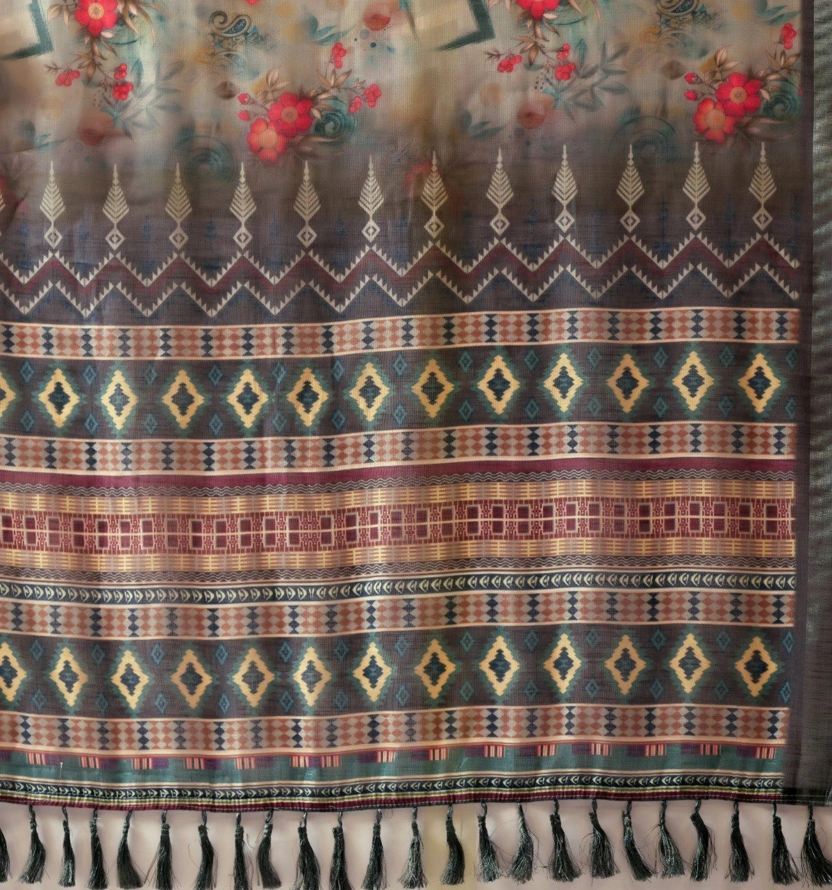 Textile with geometric pattern and fringes on a floral background