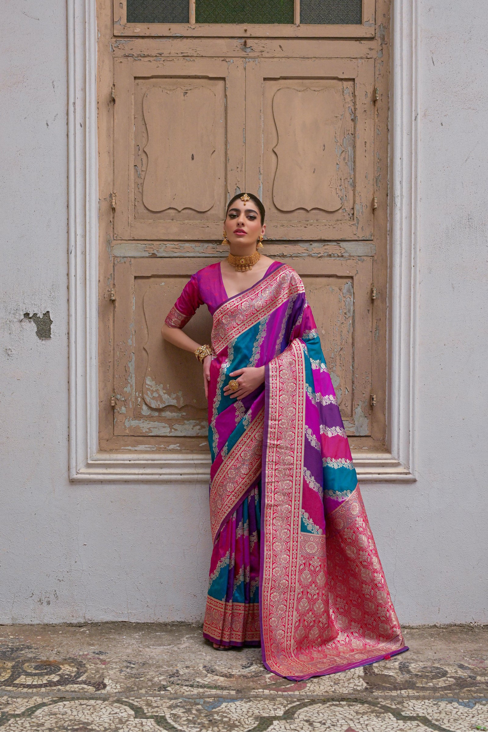 Pink saree with Kadwa style weaving and multicolor stripes