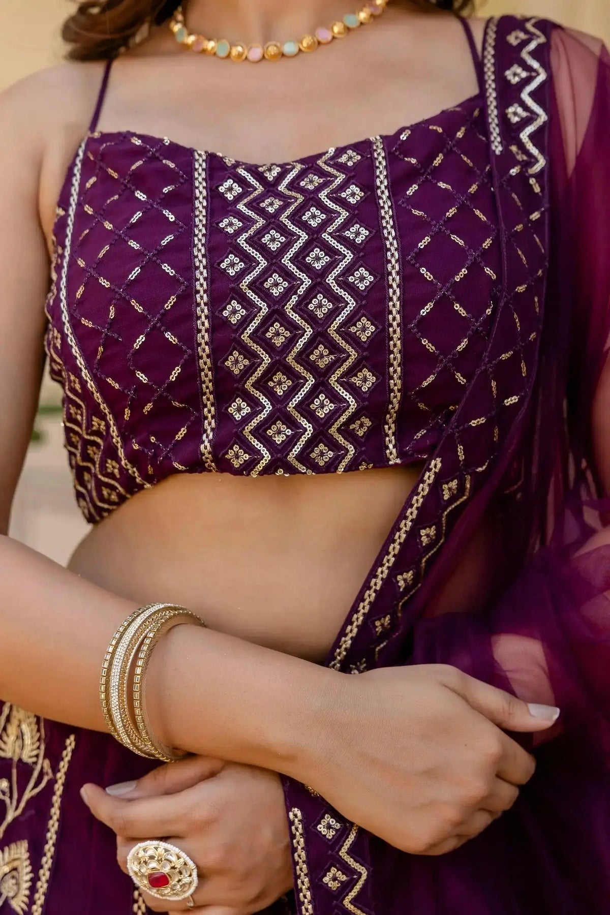 Wine Lehenga choli close-up – geometric diamond sequin pattern, round neck, sleeveless embroidered choli