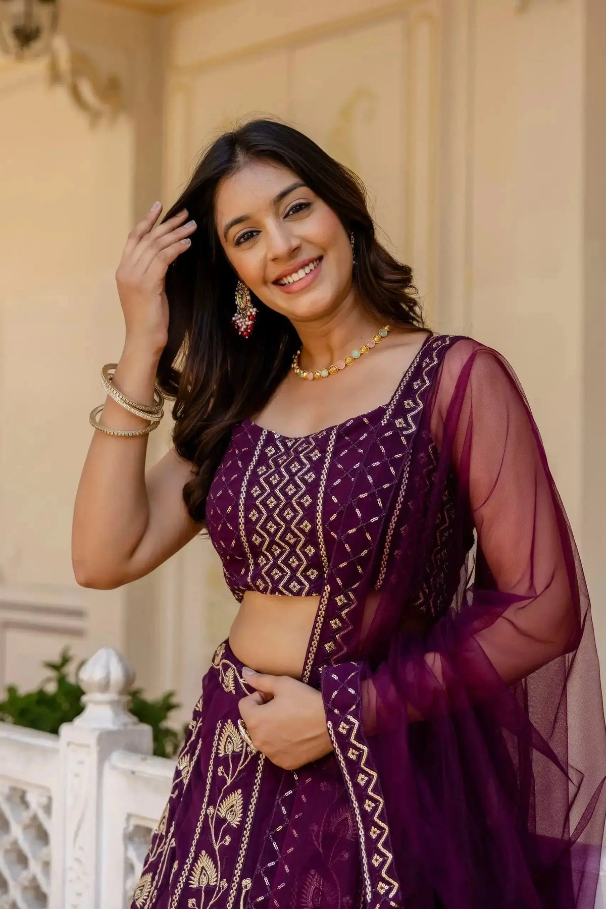 Wine Sequins Embroidered Lehenga close portrait – sequin choli detail with gold diamond pattern