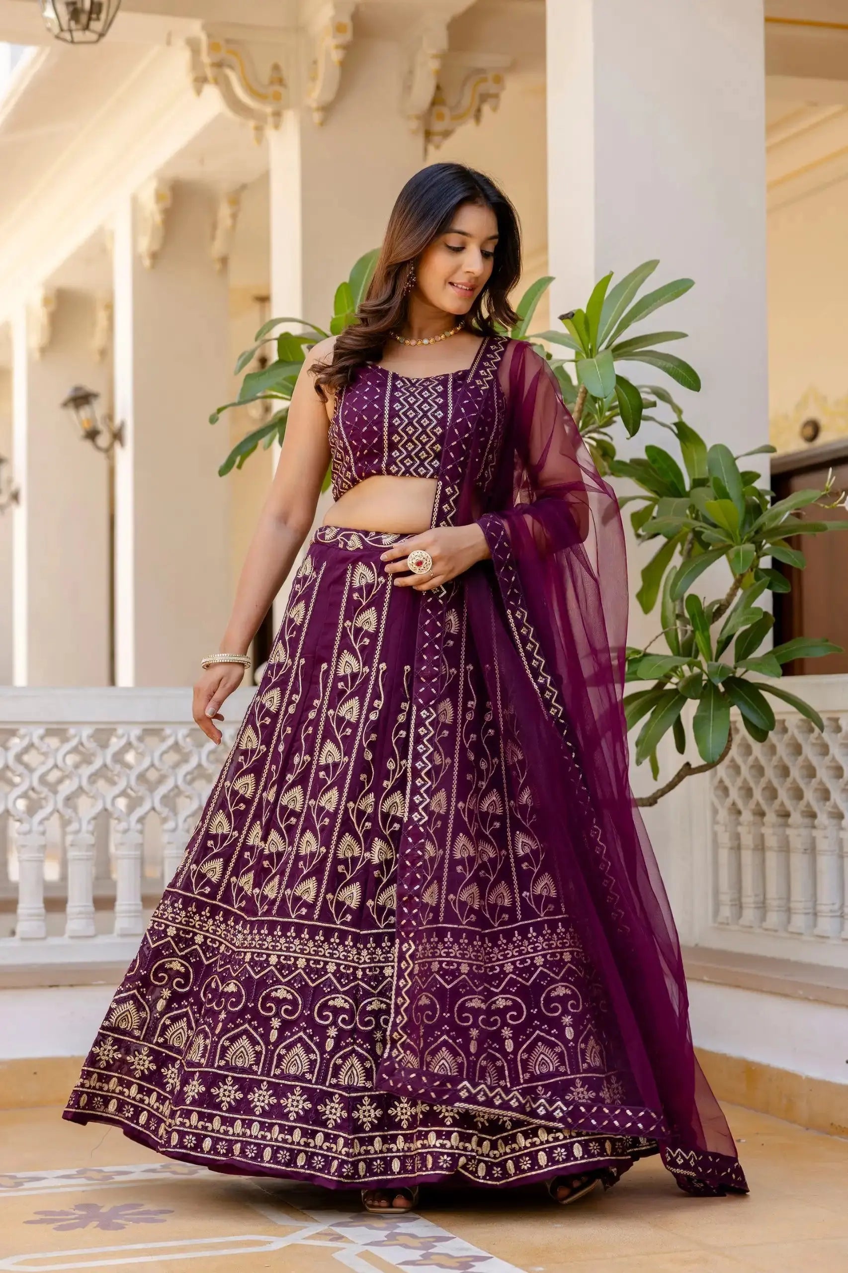 Wine Georgette Lehenga side view – dense gold sequins and thread embroidery, embroidered border