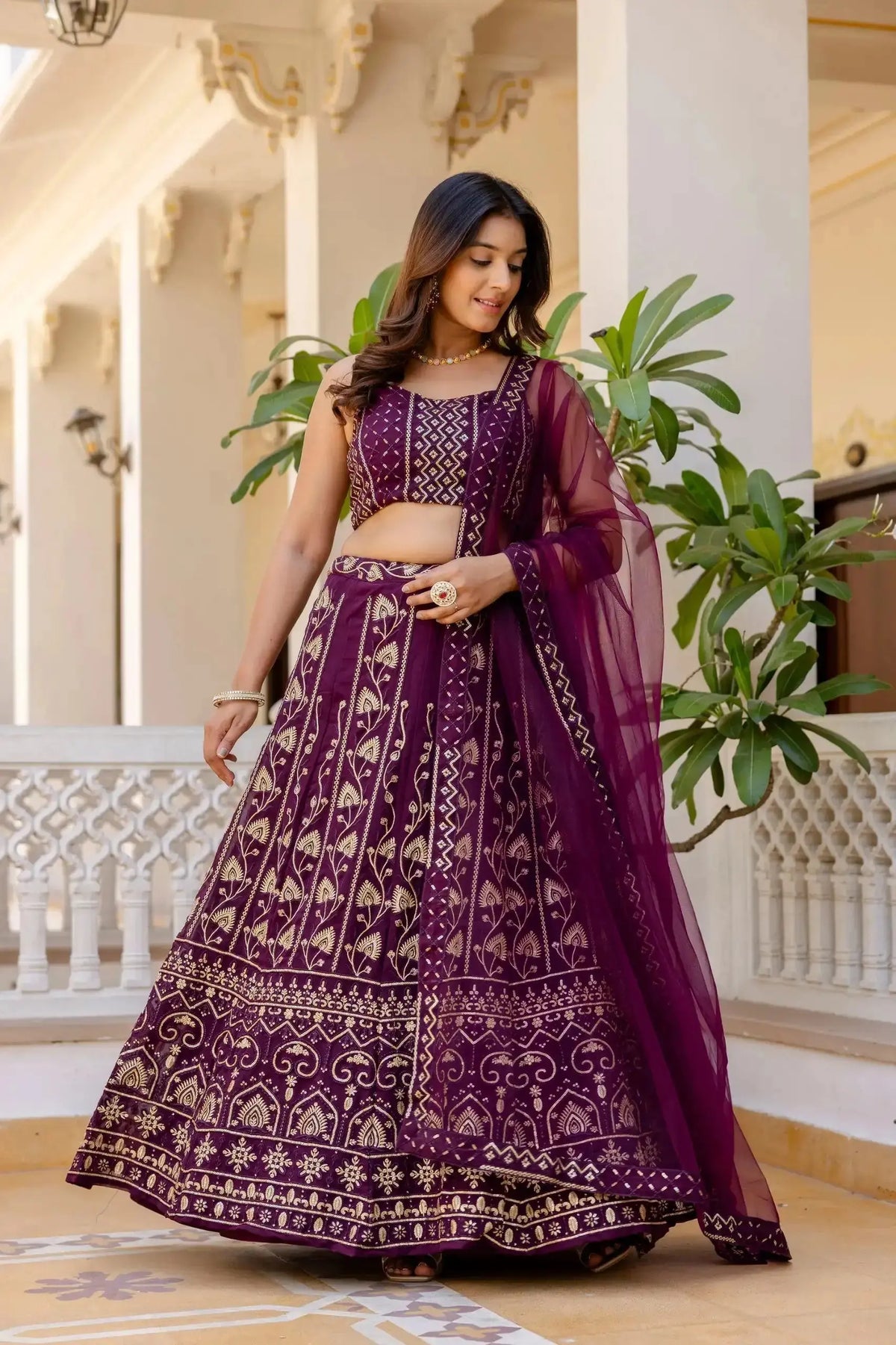 Wine Georgette Lehenga side view – dense gold sequins and thread embroidery, embroidered border
