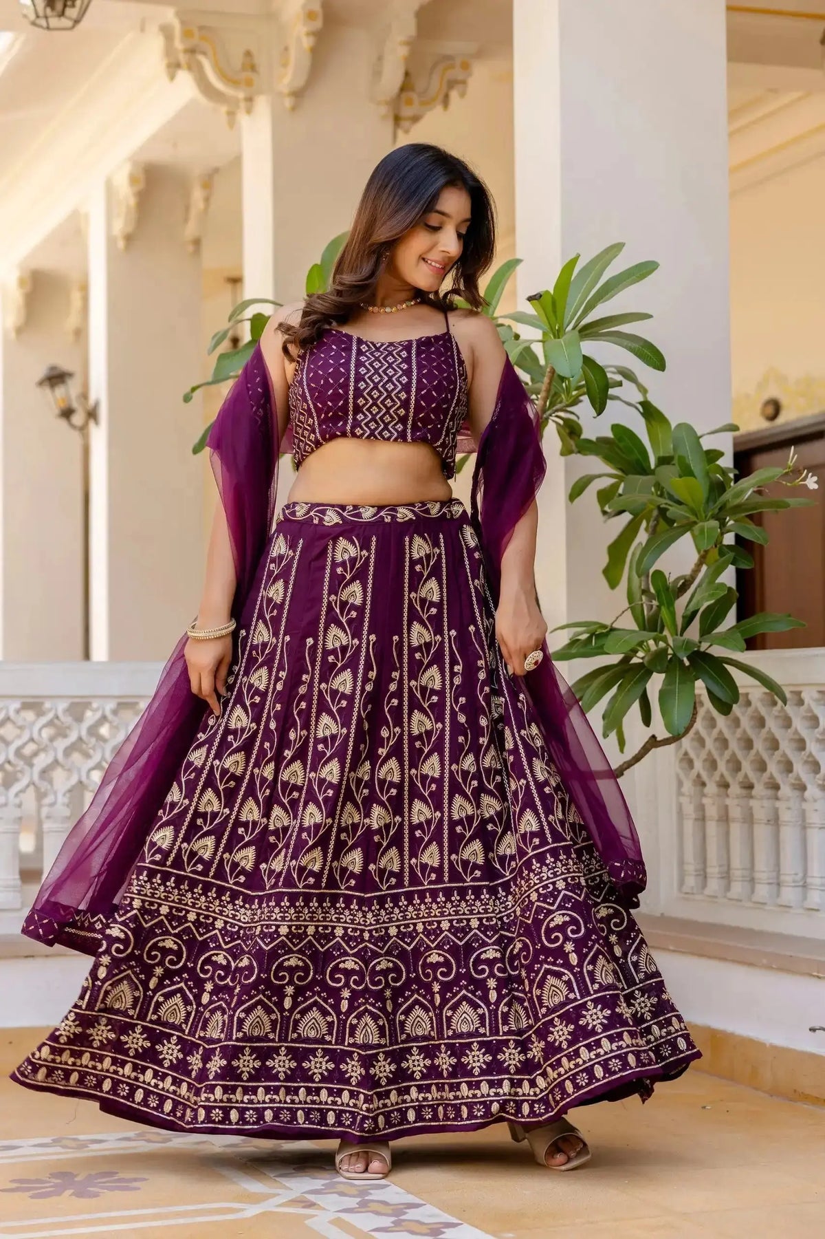 Wine Sequins Embroidered Lehenga twirl shot – circular 3 meter flair, gold thread floral motifs