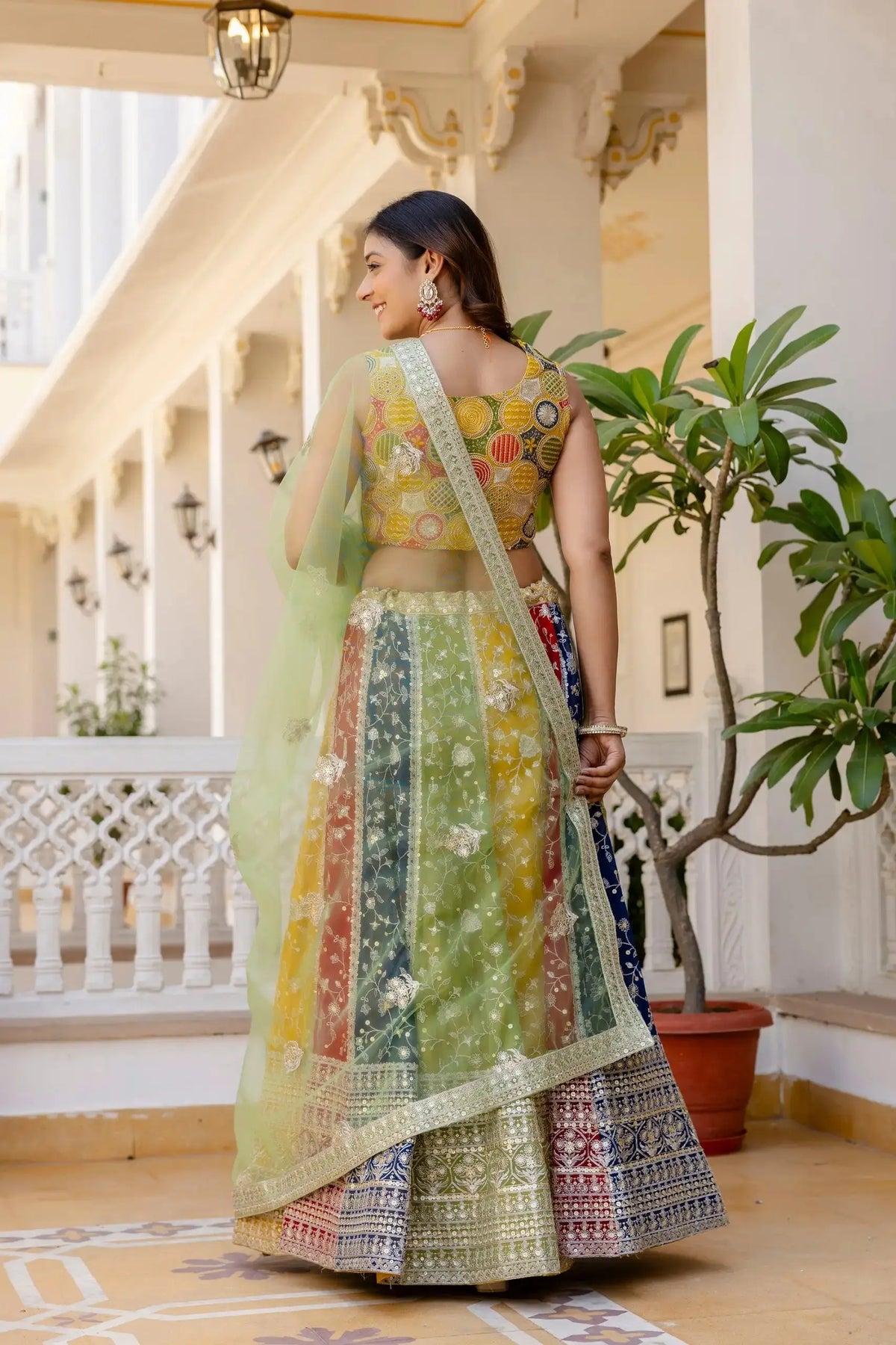 Multicolor Sequins Embroidered Lehenga back view – covered back choli with multicolor circular zardosi embroidery