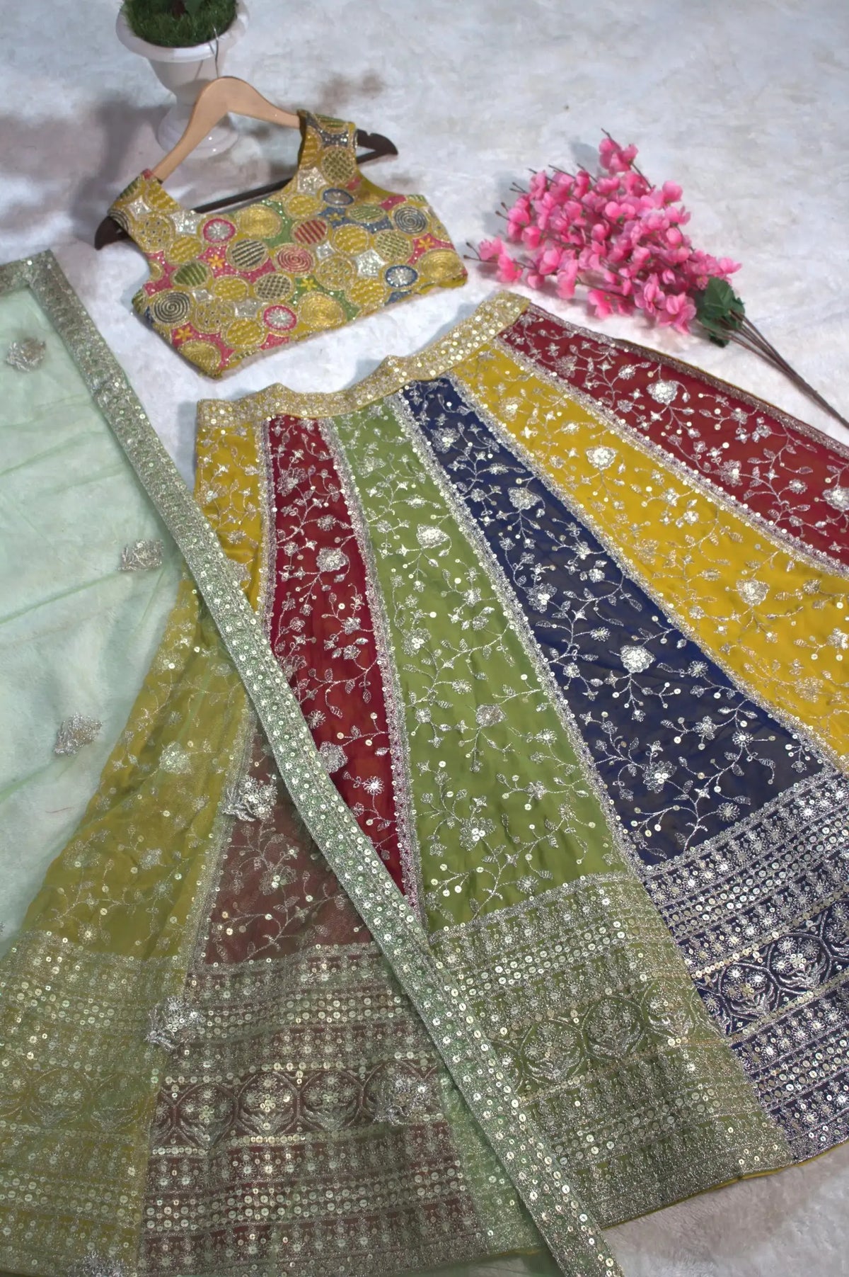 Multicolor Lehenga flat lay angle – colorblock panelled skirt with silver floral thread embroidery close-up