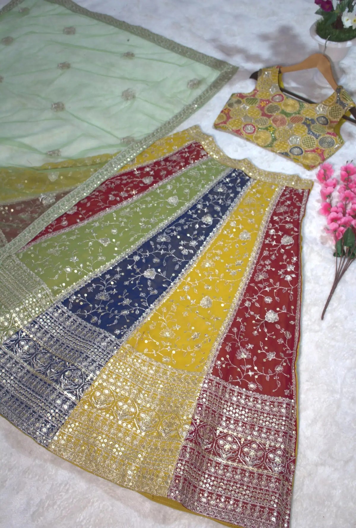 Multicolor Sequins Lehenga flat lay – skirt spread showing yellow red green navy panels and heavy sequin border