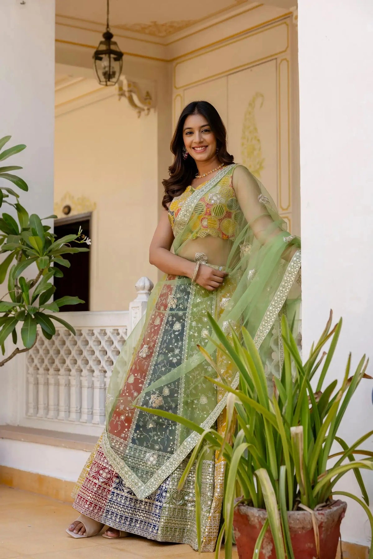Multicolor Sequins Embroidered Lehenga side view – green dupatta flowing, embroidered panelled skirt