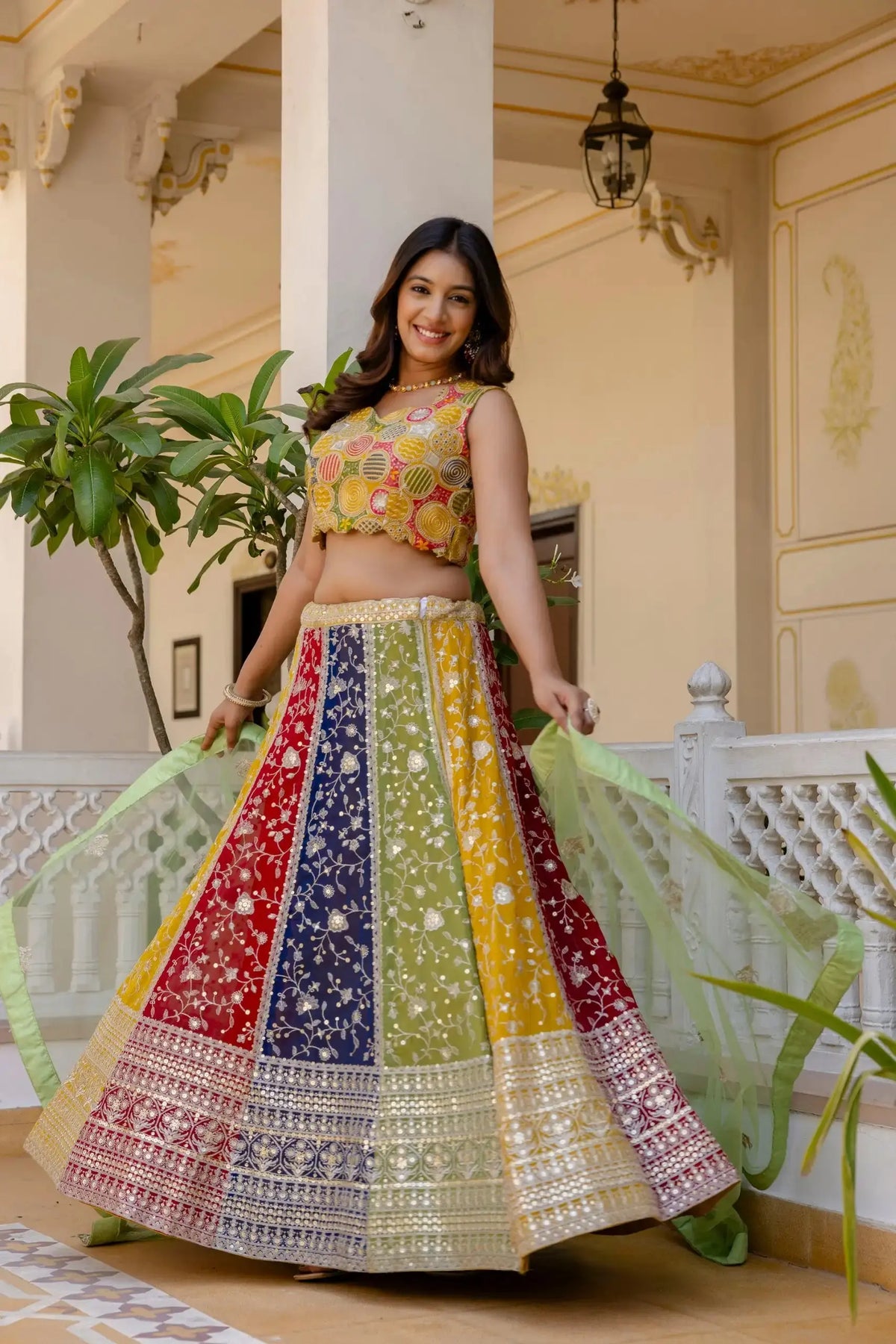 Multicolor Lehenga twirl shot – 4 meter circular flair, colorblock yellow red navy green panels with sequin border