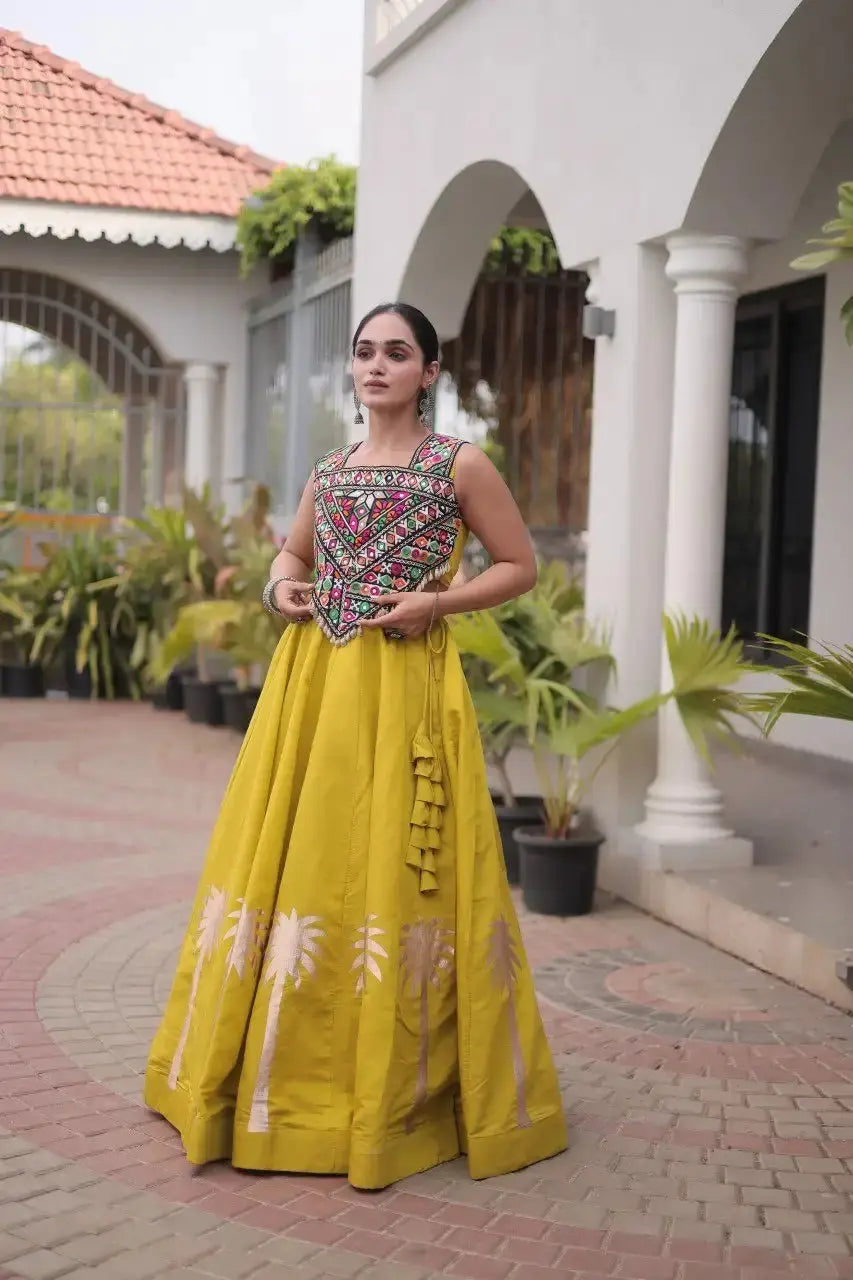 Mustard Yellow Gamthi Embroidered Lehenga – Model shot showing warm mustard skirt with copper palm hem print
