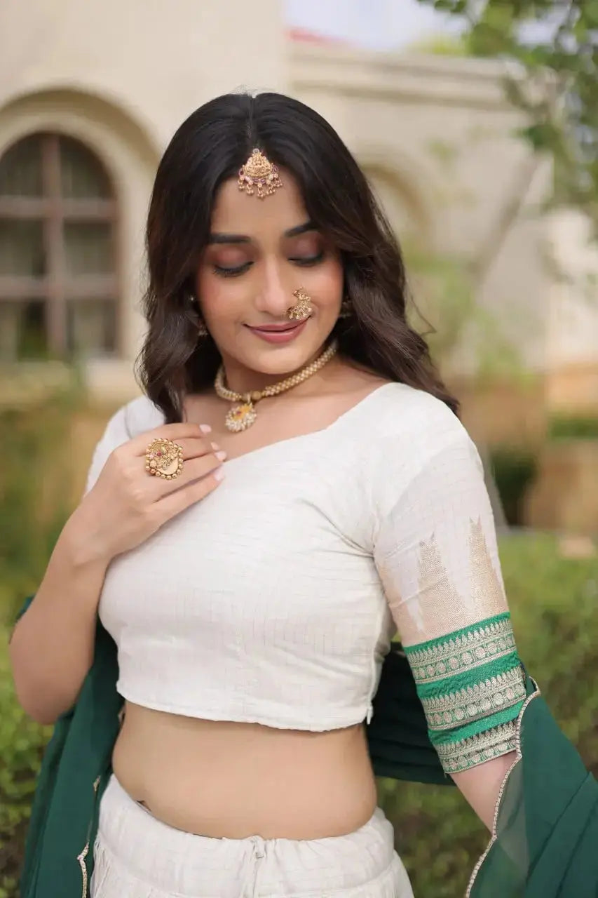 Green Zari Weaving Lehenga sleeve close-up – half sleeve choli with intricate green and gold zari band at cuff