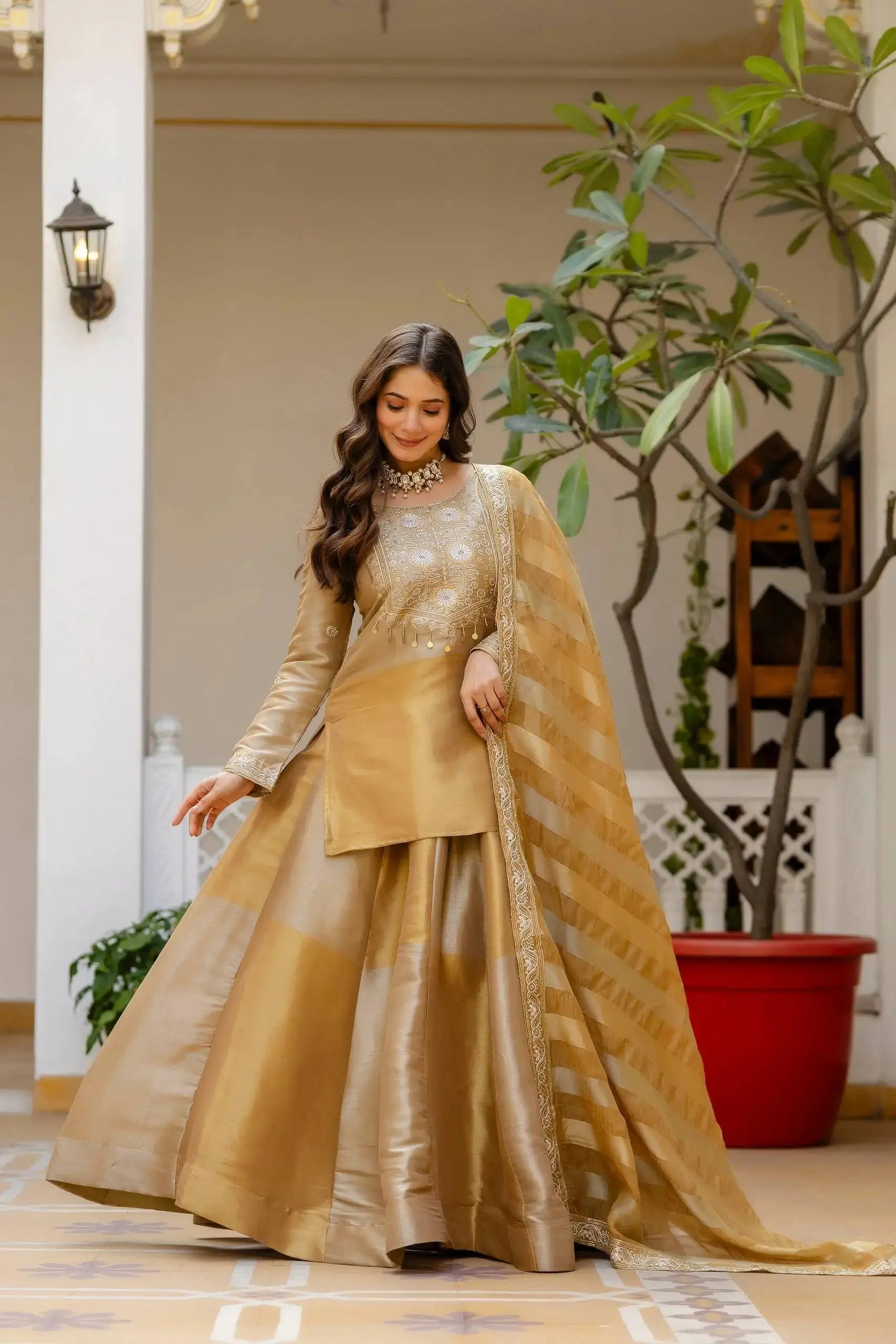 Beige Lehenga looking down with fanned skirt – Banarasi Viscose fabric, striped dupatta draped, festive wear