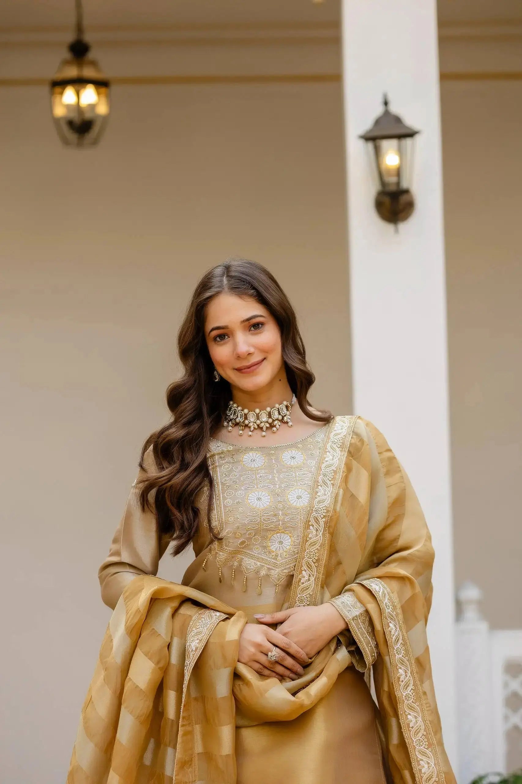 Beige Banarasi Lehenga portrait – handwork yoke embroidery close-up, gold coin tassels, tissue dupatta detail