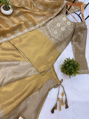 Beige Lehenga kurta top flat lay close-up – handwork yoke embroidery detail, gold coin tassels, lace border on dupatta