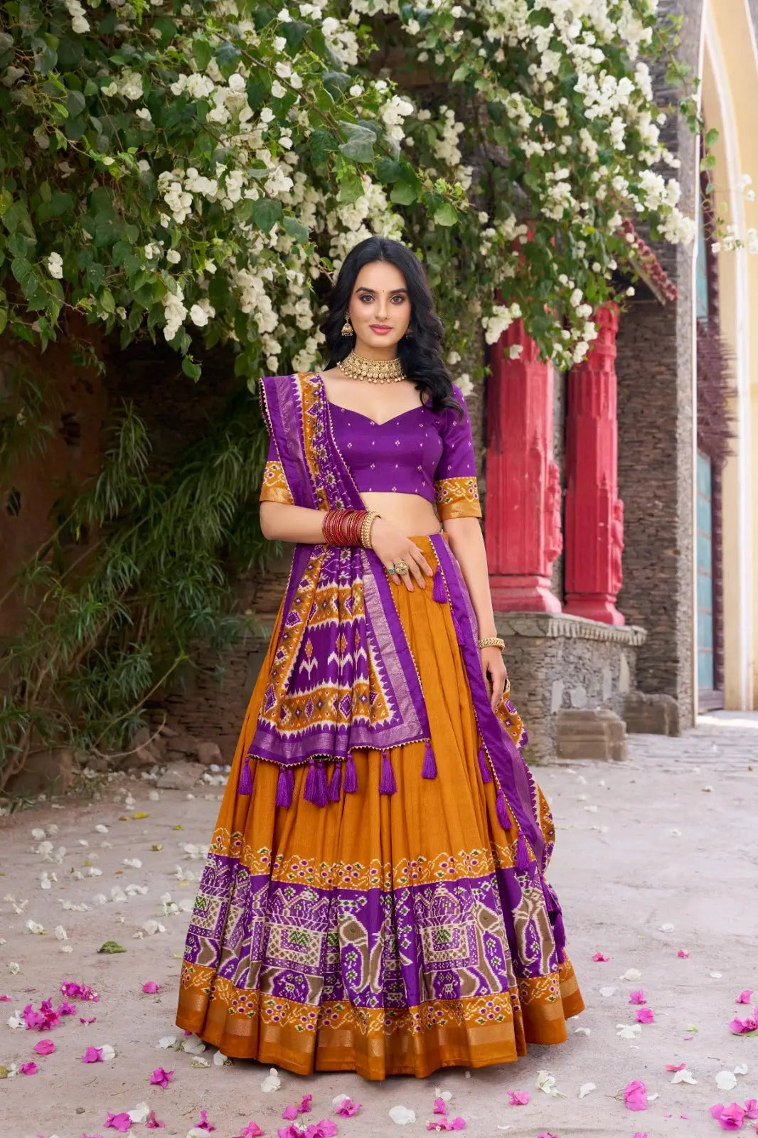 Mustard Yellow Floral Print Lehenga – Front drape view showing Tussar Silk Blend skirt with patola elephant border and gold foil work