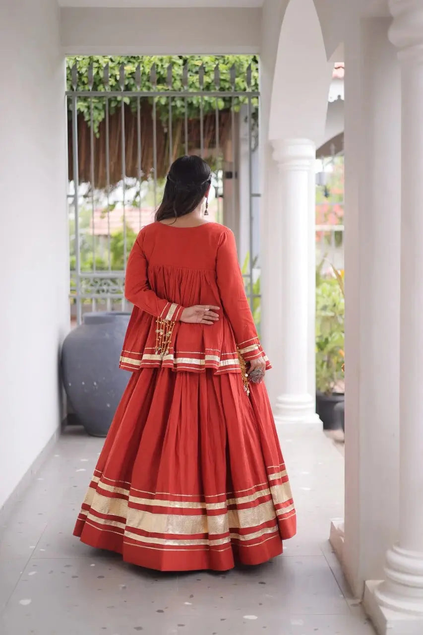 Red Zari Work Lehenga – Model wearing red peplum lehenga set with gold zari borders, Navratri festive wear