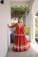 Red Zari Work Lehenga – Side view showing 3.5-meter circular flair and full sleeve peplum top with kodi tassel cuffs