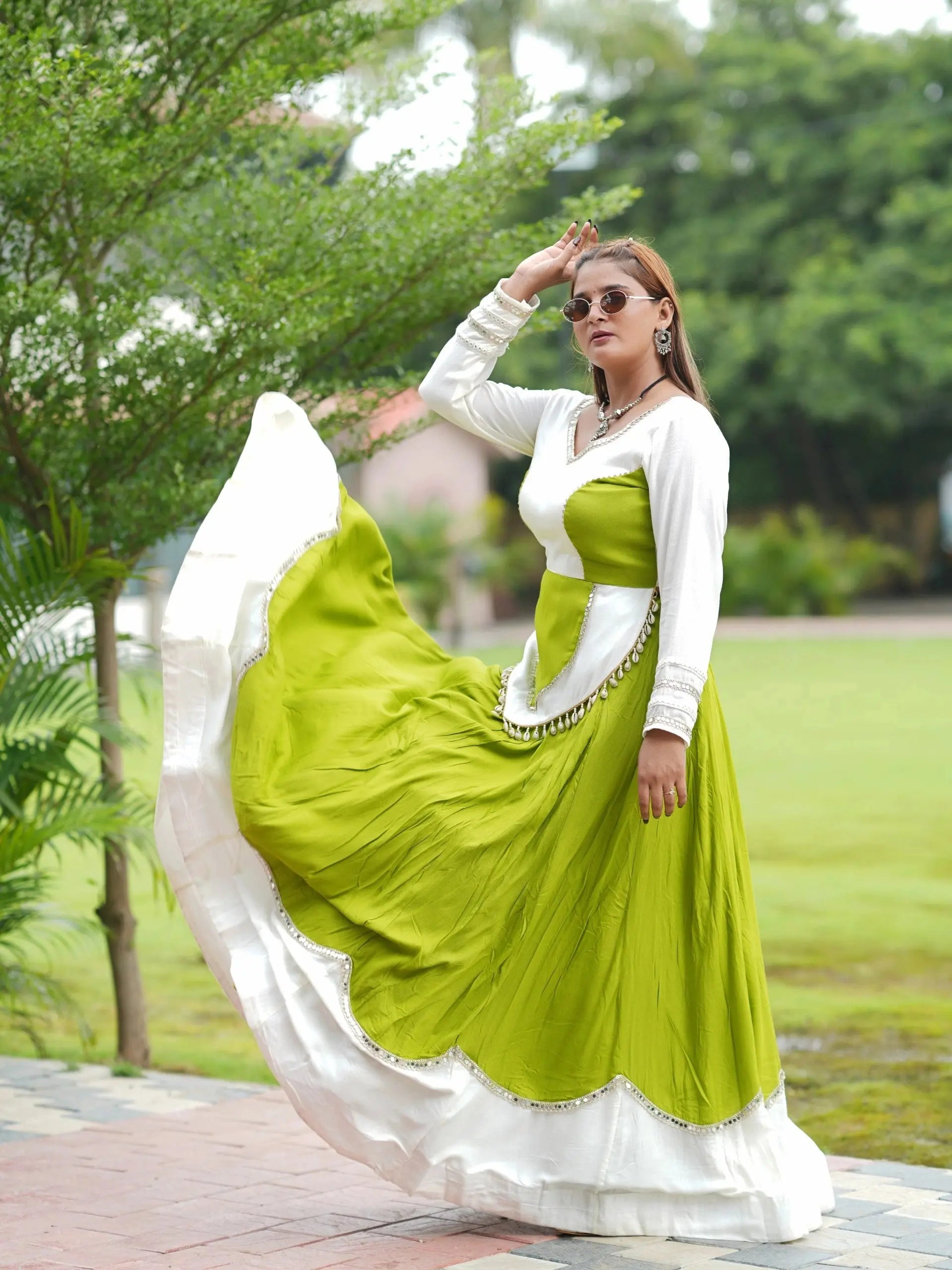 Green Mirror Lace Work Lehenga – Side view showing 6-meter flair and V-neck full sleeve choli with cowrie shell peplum detail