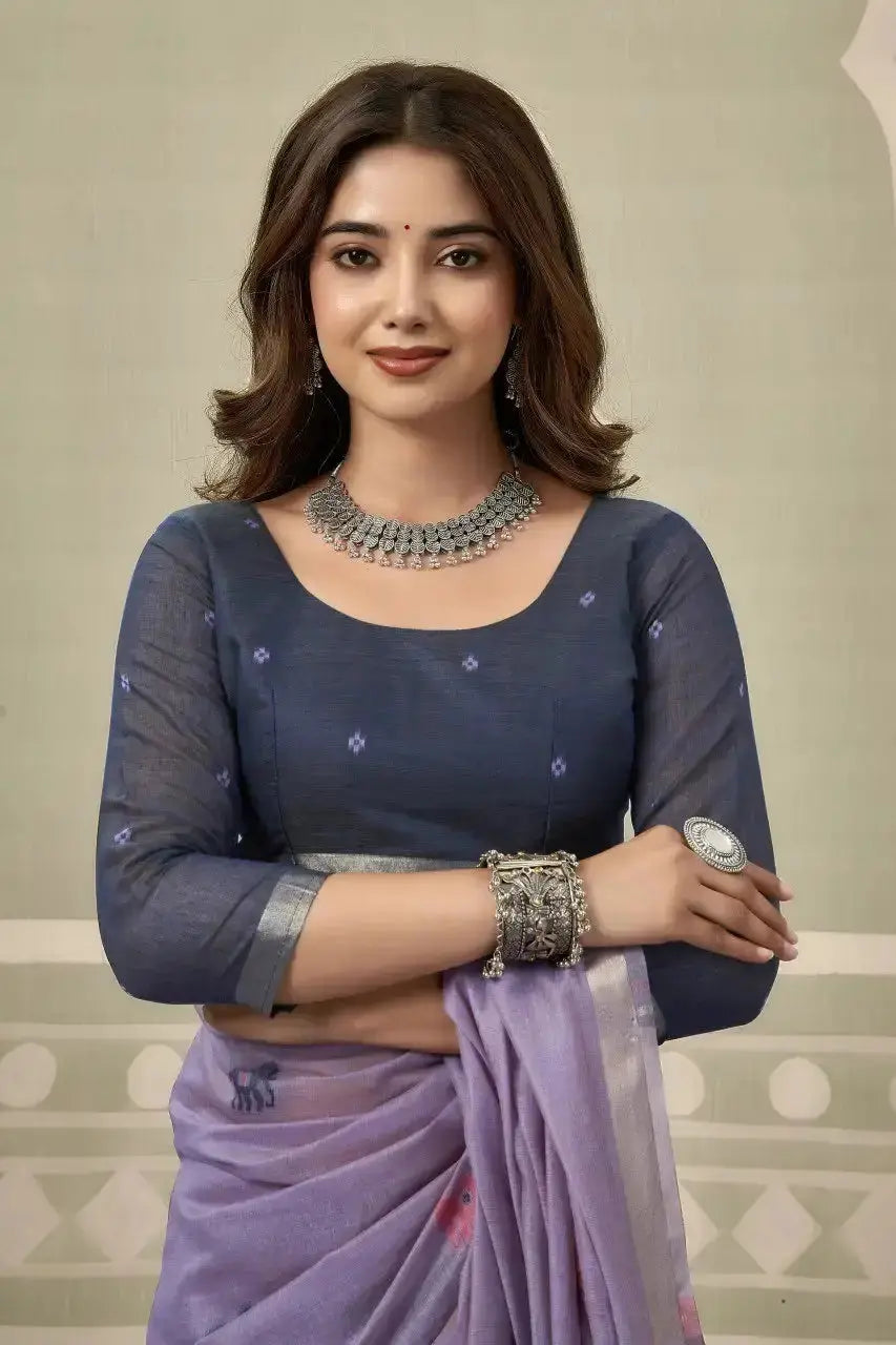 Close-up blouse view — Heavy Cotton saree with scattered woven animal motifs and silver zari border