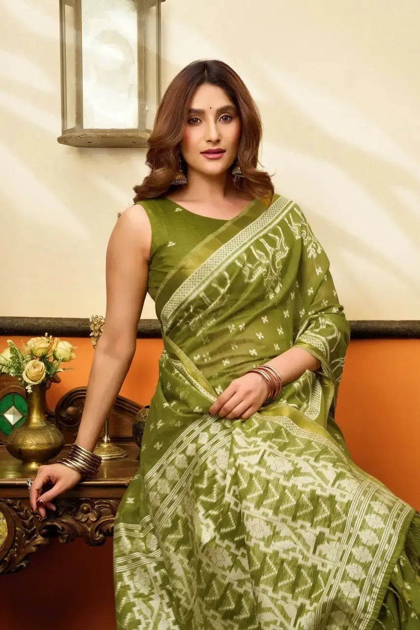 Seated half body view of Android Green Jacquard Weaving Saree — blouse and woven ikat design detail