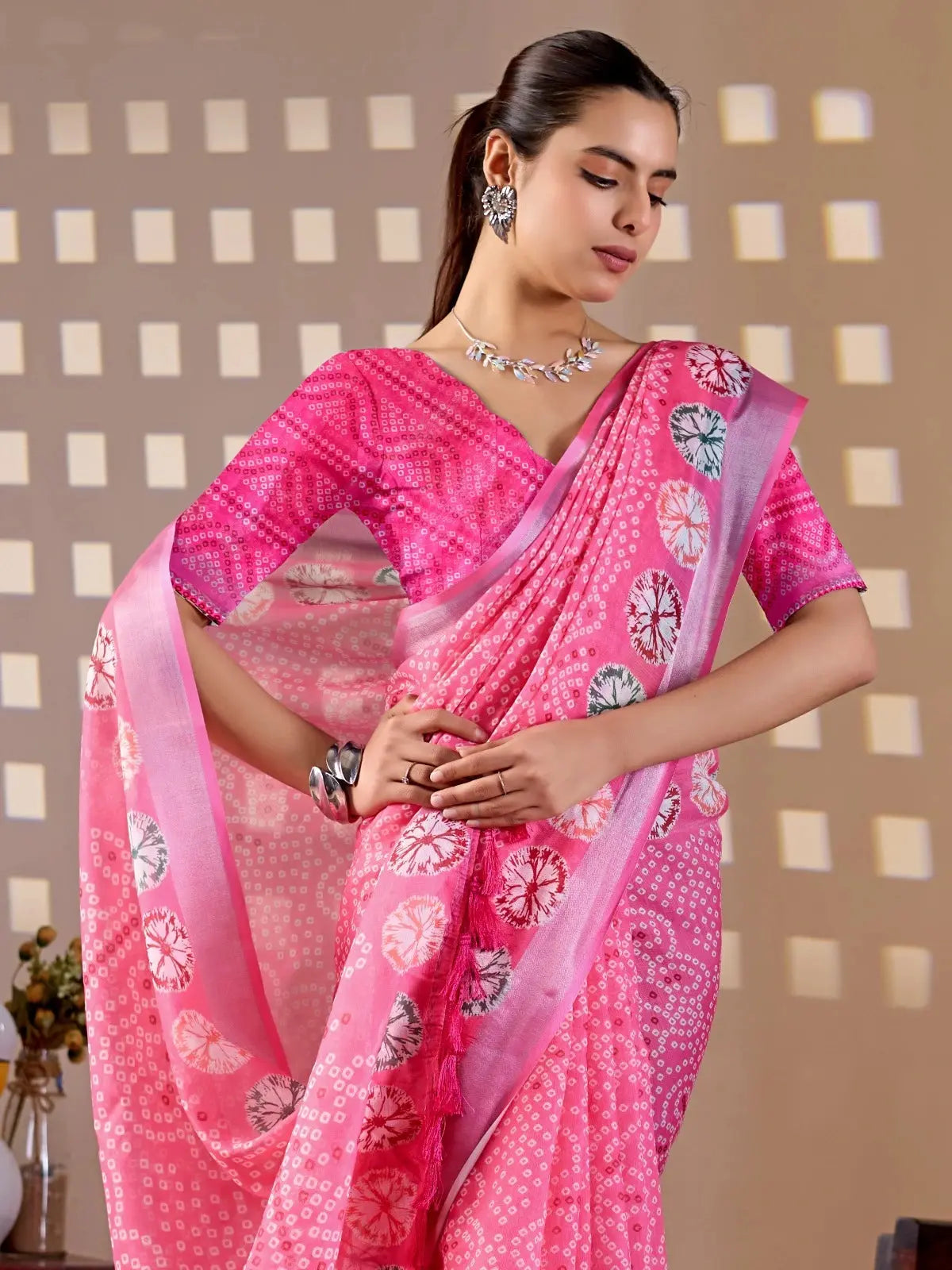 Close-up half body of Pink Bandhani-Style Digital Print Saree with circular shibori motif detail