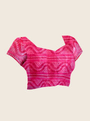 Flat lay of running blouse piece — Pink Floral Digital Print Saree with matching magenta bandhani blouse