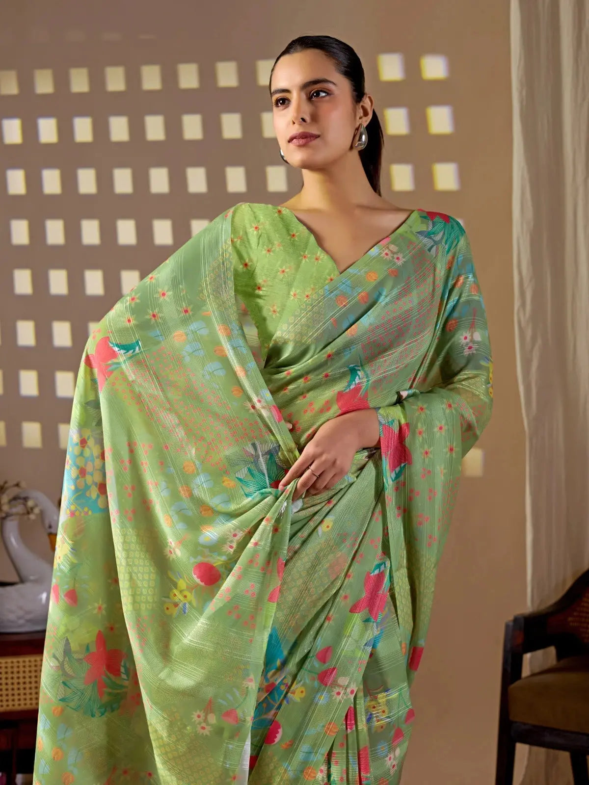 Half body view of Pista Green Floral Digital Print Saree — holding pallu showing floral motif detail