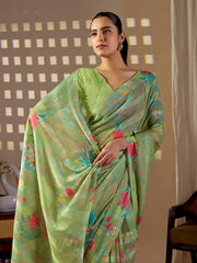 Half body view of Pista Green Floral Digital Print Saree — holding pallu showing floral motif detail