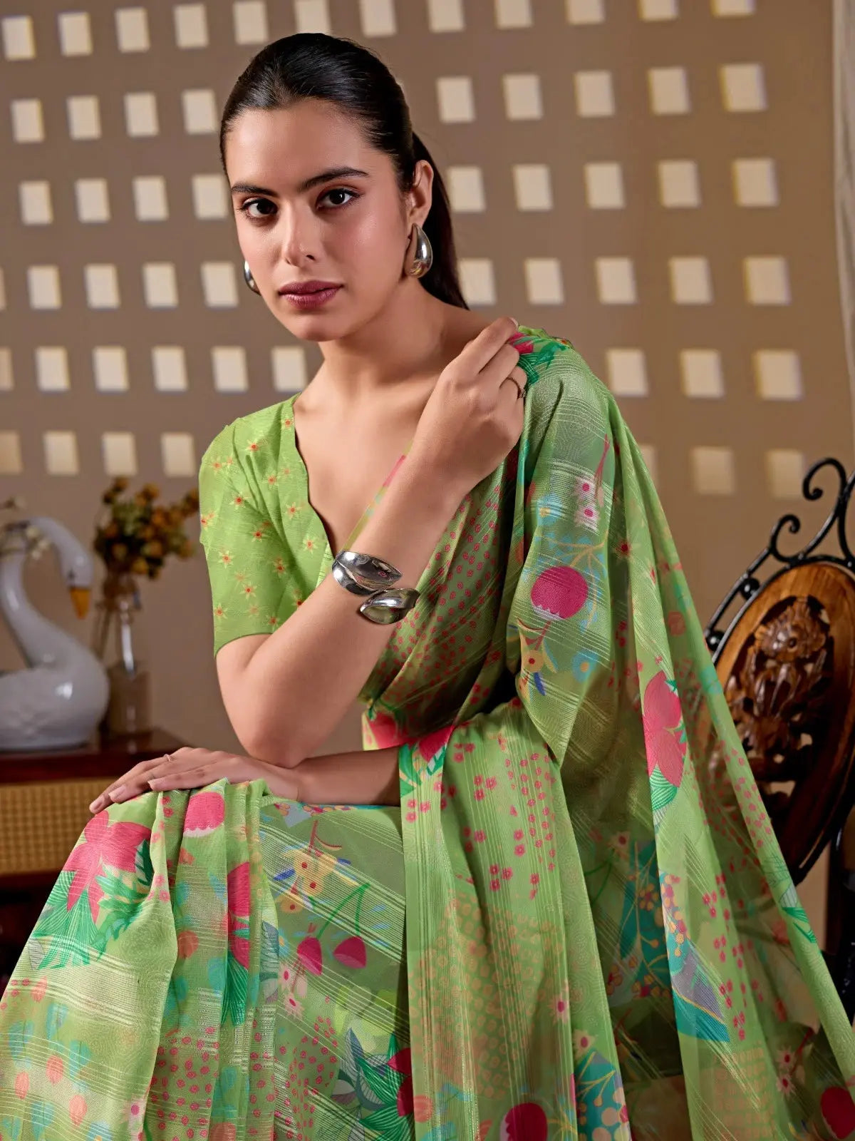 Seated close-up of Pista Green Floral Digital Print Saree — blouse and floral print detail