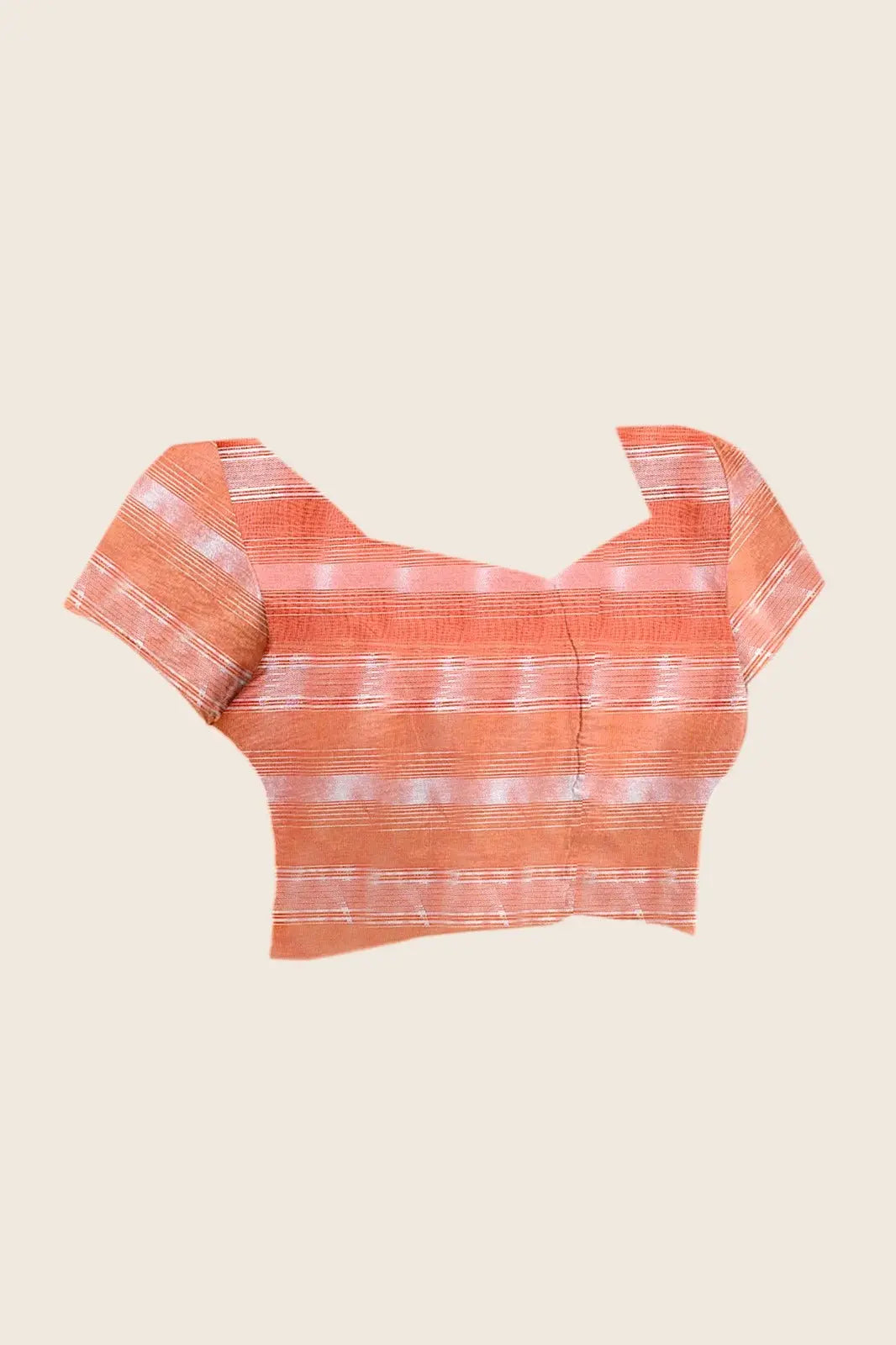 Flat lay of running blouse piece — Soft Peach & Wine Ombre Saree matching peach woven stripe blouse