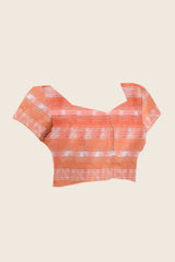 Flat lay of running blouse piece — Soft Peach & Wine Ombre Saree matching peach woven stripe blouse