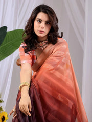 Half body close-up of Soft Peach Wine Ombre Saree — silver woven diagonal stripes on peach fabric