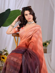 Seated close-up of Soft Peach & Wine Ombre Saree showing woven stripe texture and ombre transition
