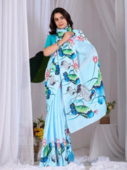 Sky Blue Satin Georgette Saree – model holding pallu showing all-over digital print detail