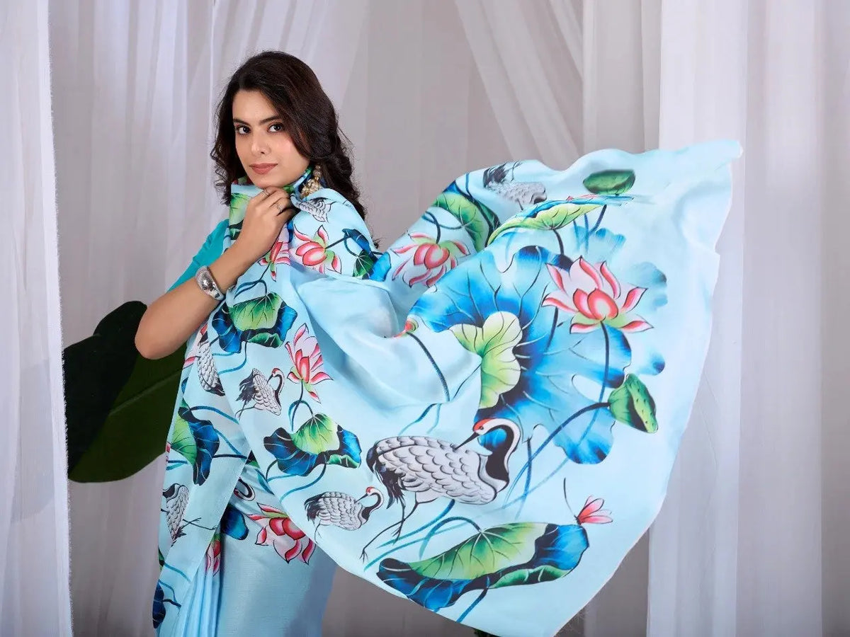 Sky Blue Digital Print Saree – pallu close-up with white crane and pink lotus motif on satin georgette