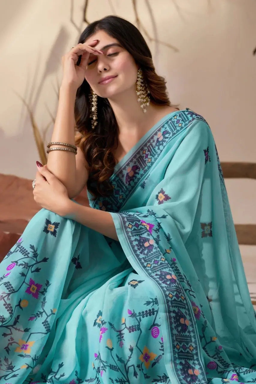 Powder Blue Georgette Saree – seated close-up showing border detail and floral buti print