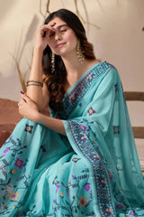Powder Blue Georgette Saree – seated close-up showing border detail and floral buti print