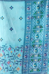 Powder Blue Georgette Saree border detail – Patola-style elephant and geometric motif contrast border with teal tassels