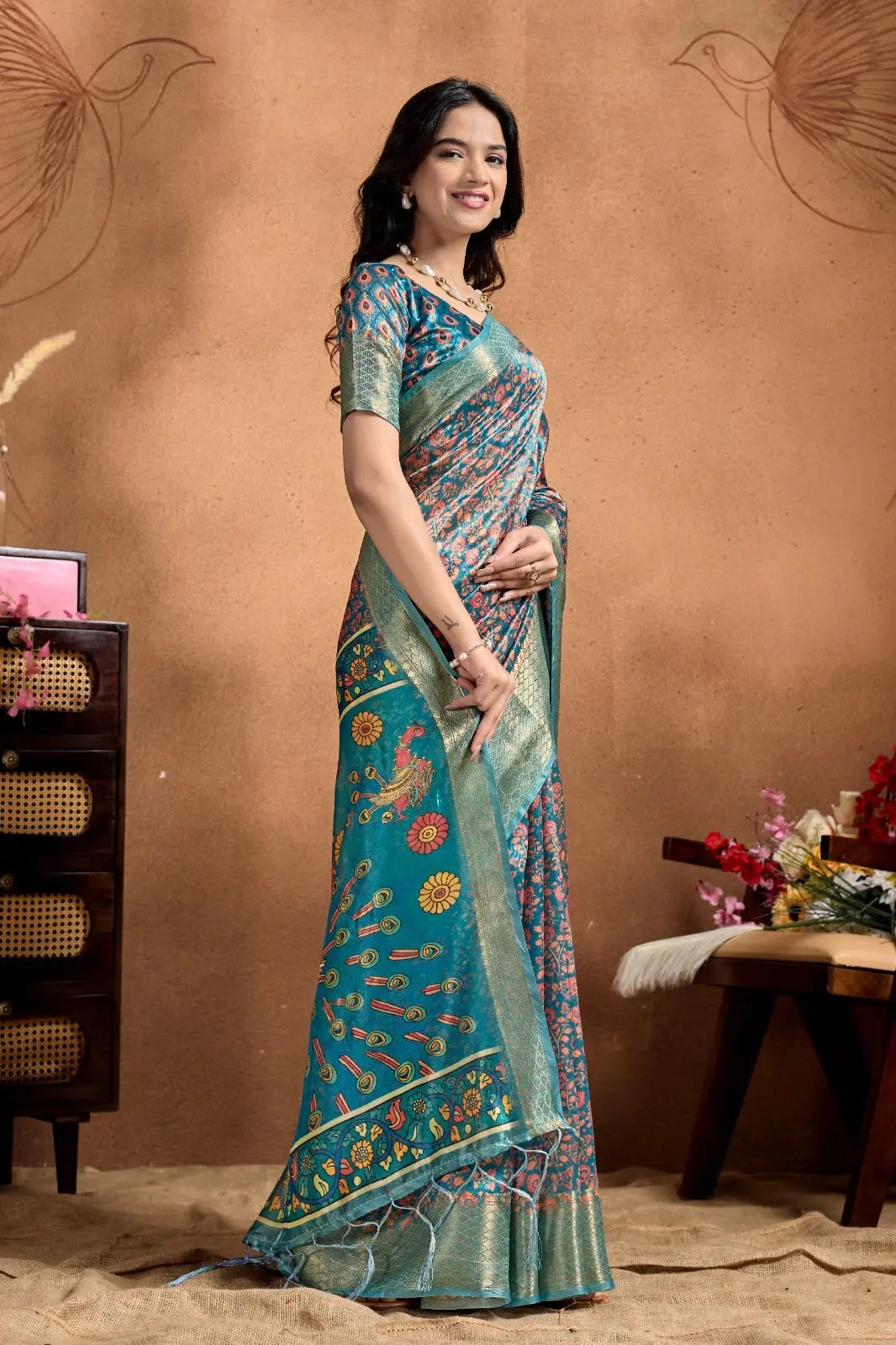 Rama Blue Kalamkari Print Saree – full length side view showing pallu drape and teal tassels at hem