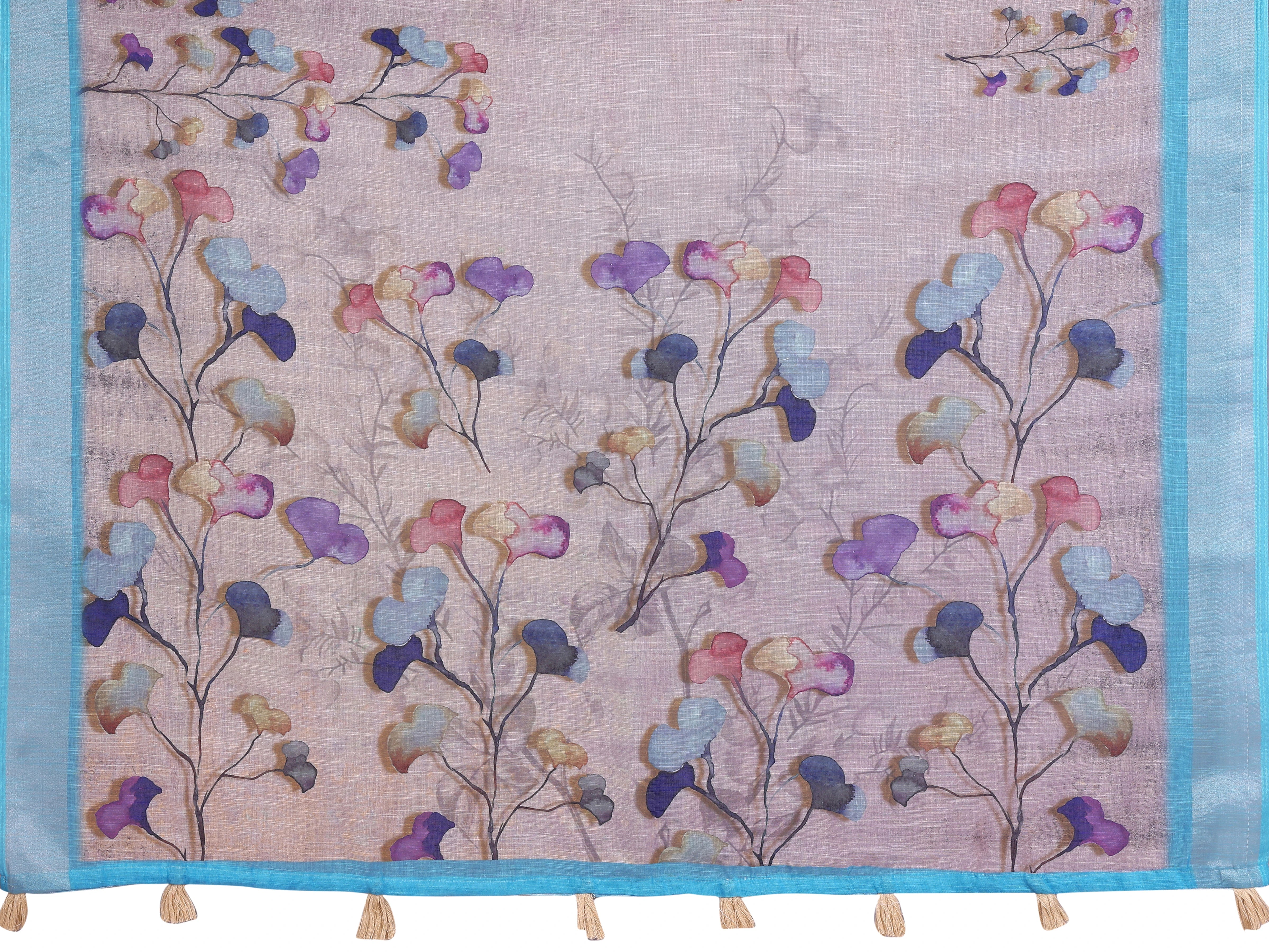 Lavender Linen Cotton Saree fabric detail – watercolour botanical petal clusters in purple, blue and pink with turquoise border and cream tassels