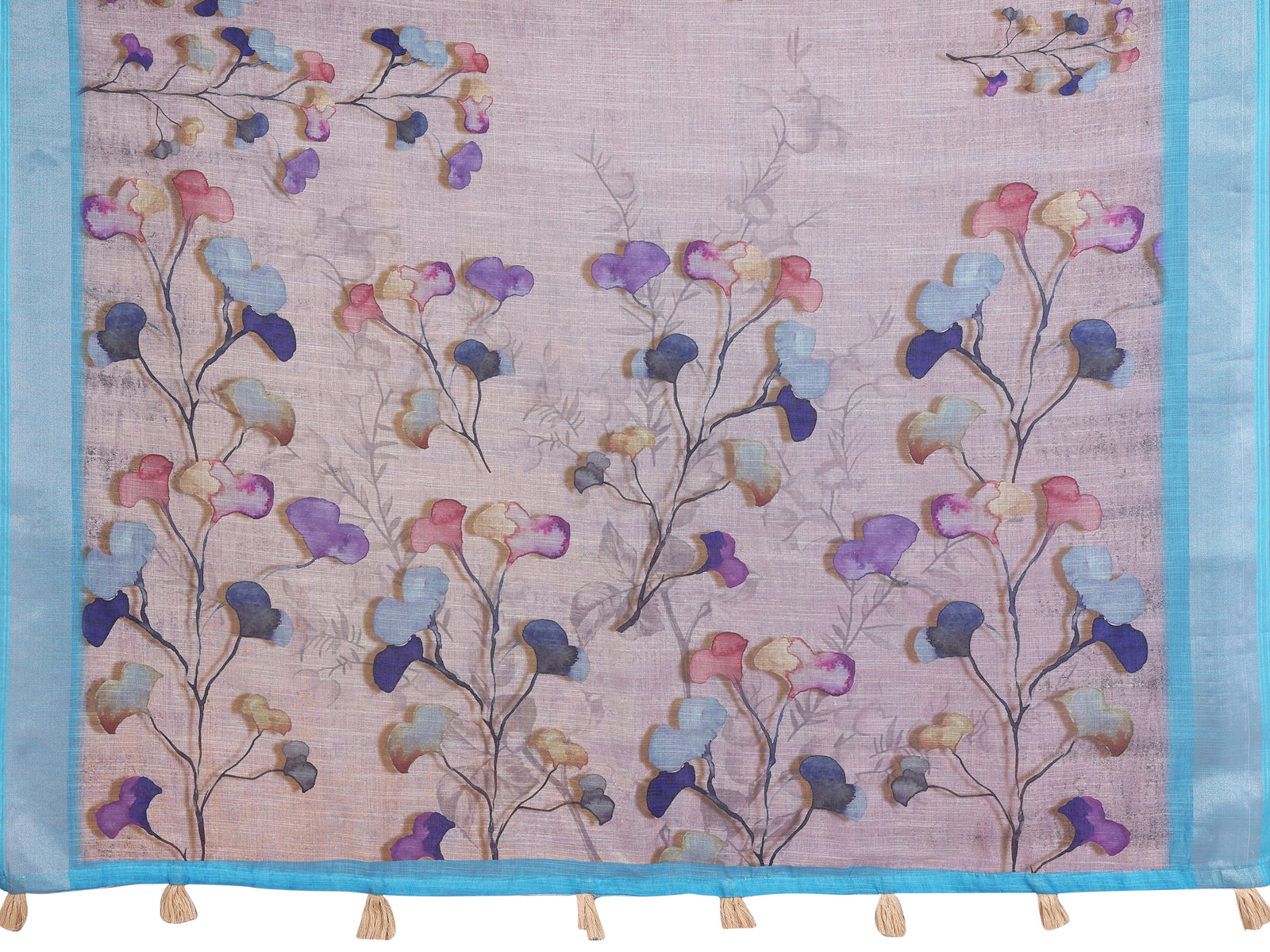 Lavender Linen Cotton Saree fabric detail – watercolour botanical petal clusters in purple, blue and pink with turquoise border and cream tassels