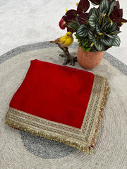 Red Satin Silk Saree – product flat lay showing folded saree with gold lace border corner detail