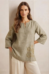 Olive Green Embroidered Linen Short Kurti – Front View Against Wall | Kalyanja