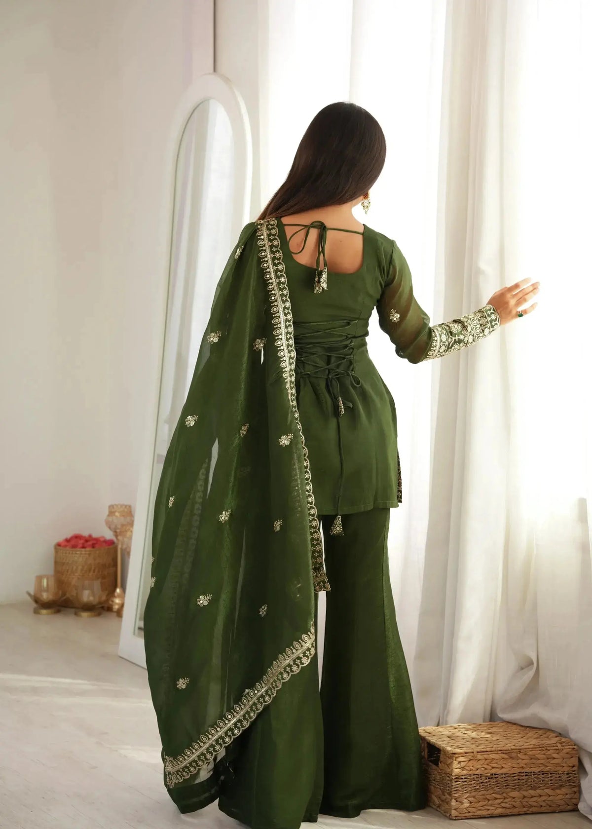 Back view of Olive Green Suit showing open dori tie-up corset back and embroidered sleeve cuffs