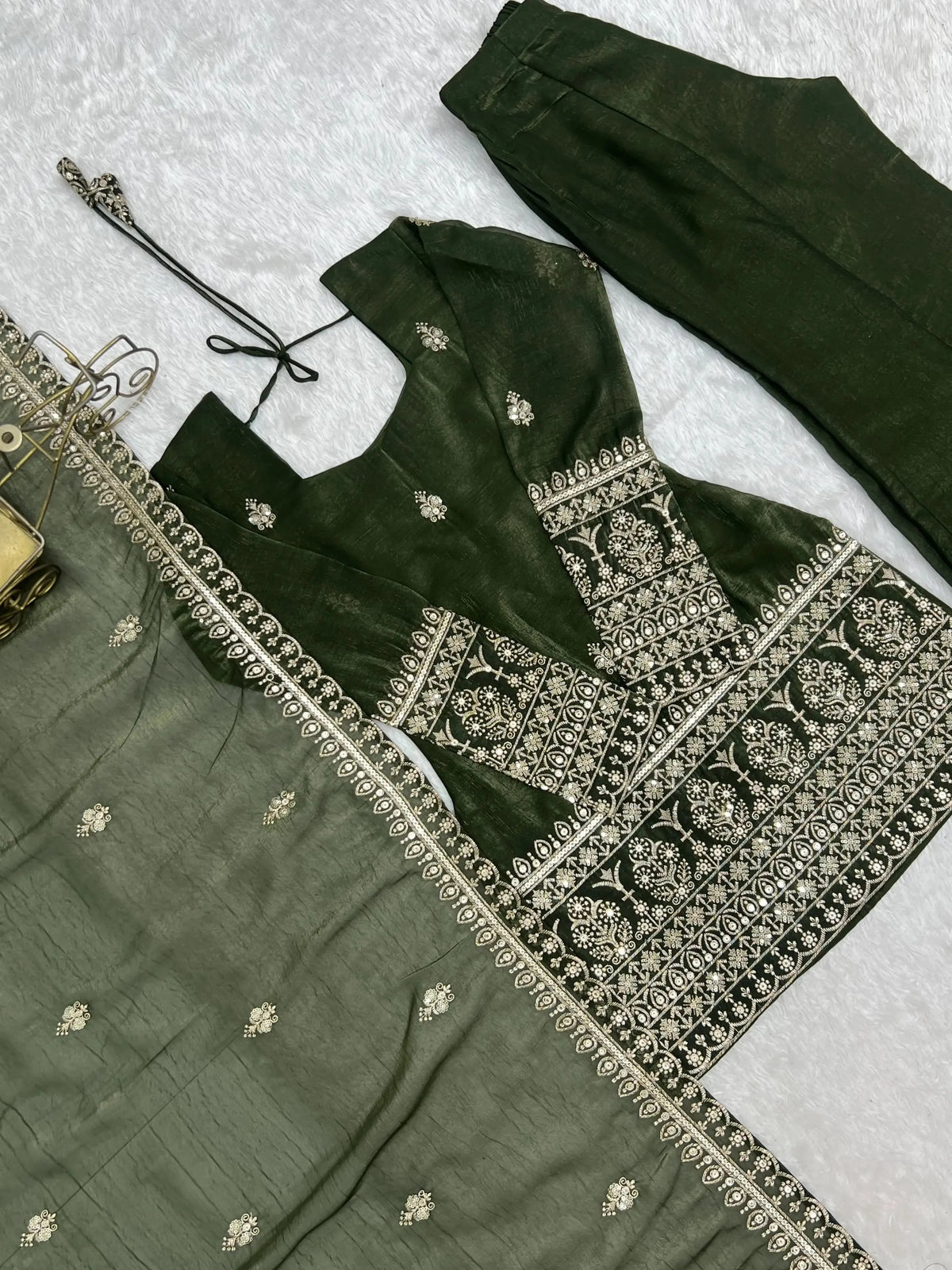 Flat lay detail — embroidery panel and dupatta of Olive Green Sequins Embroidered Zari Suit